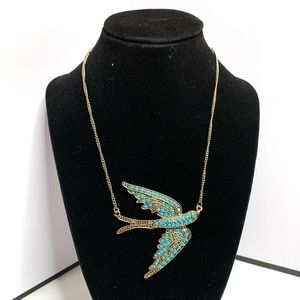 Brass and turquoise bird necklace